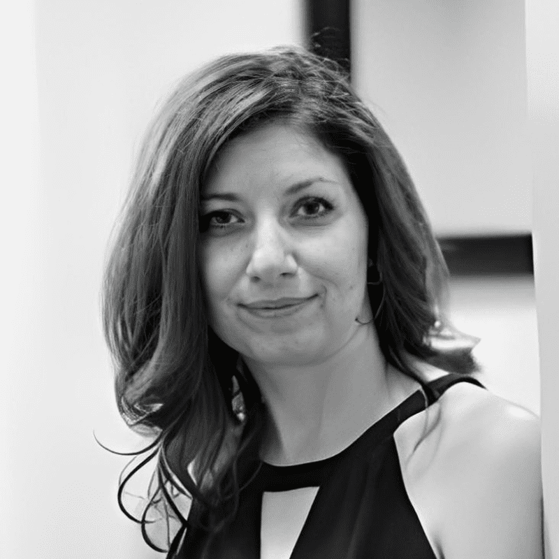 Black-and-white portrait of smiling woman