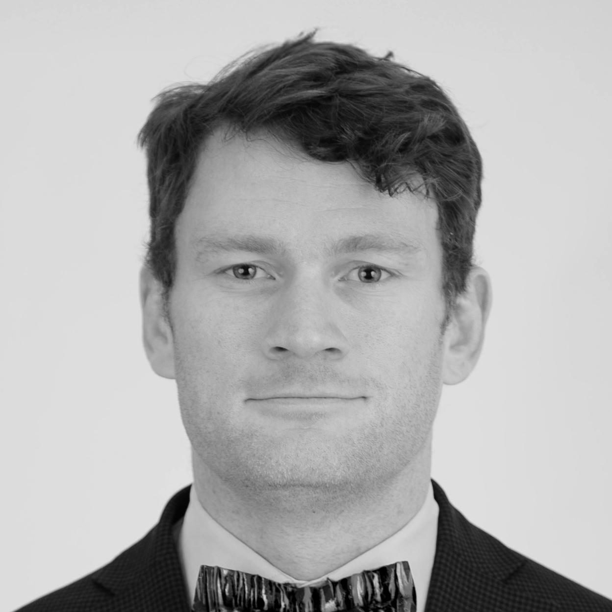 Monochrome headshot of man wearing bow tie
