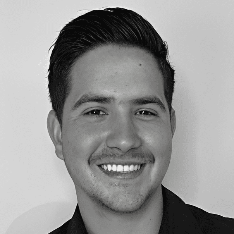 Black-and-white smiling young man headshot